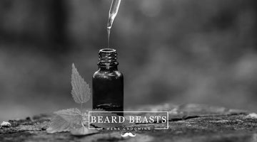 Dropper bottle of beard oil highlighting beard oil benefits with natural leaf, Beard Beasts men's grooming logo