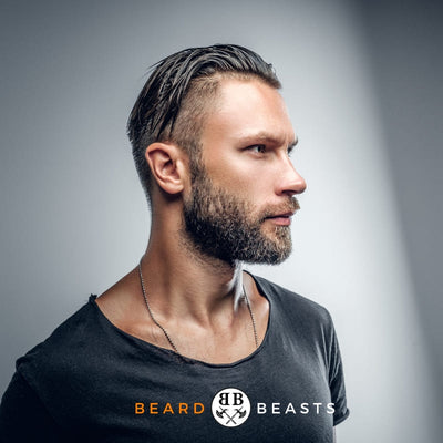 Stylish man with expertly groomed beard showcasing different beard hair types for Beard Beasts style guide