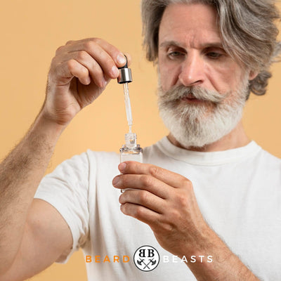 Featured image for 'Does Beard Oil Expire?' article: A hand holding a bottle of beard oil with dropper, against a stylish background.