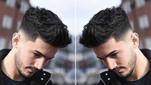 Featured image of a stylish low fade quiff hairstyle on a young man, highlighting a clean fade on the sides with a textured, voluminous top. 