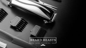 A set of hair clippers and various attachments displayed on a dark surface, indicating specialized grooming equipment for men, relating to the query "Can You Cut Wet Hair With Clippers?