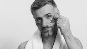 Man applying serum for men's facial skin care routine