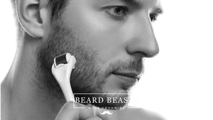 Man using a beard roller on his cheek to promote facial hair growth, wondering Do beard rollers work?
