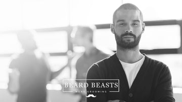A professional-looking man with a buzz cut in a business setting, posing for Beard Beasts Men's Grooming, embodying the debate on is a buzz cut professional?