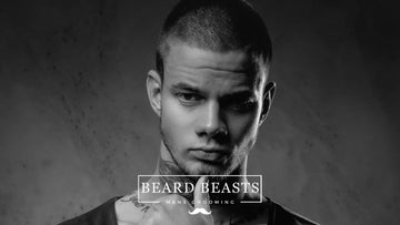 Man showcasing number 2 buzz cut hairstyle for Beard Beasts men's grooming promotion
