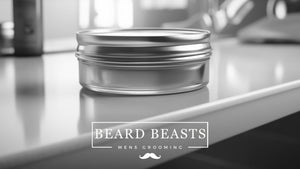 A tin of men's grooming hair clay on a sleek countertop with a blurred background, featuring the 