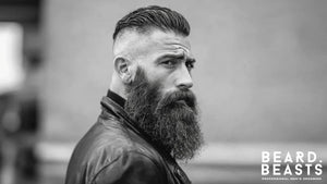 Bearded man with long full beard and slicked back hair representing the proven benefits of facial hair for men