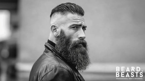 Bearded man with long full beard and slicked back hair representing the proven benefits of facial hair for men