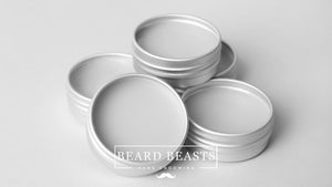 Multiple open tins of unscented beard balm displayed on a neutral background, emphasizing the product's purpose in men's grooming, with a focus on what does beard balm do for maintaining and styling facial hair.
