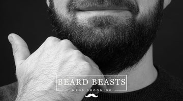  Close-up of a man's lower face and beard with a hand on the chin, showcasing Beard Beasts Men's Grooming products, potentially dealing with beard hair bumps.