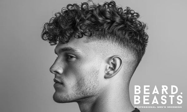 profile portrait of a young man with a high drop fade with a curly top, featuring a sharp fade that blends smoothly into voluminous, well-defined curls.