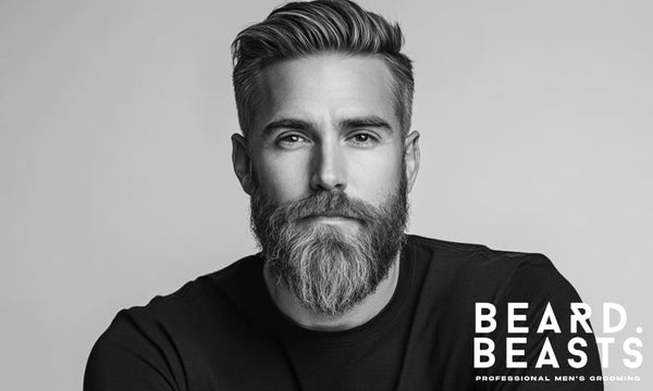 Man with thick beard hair sticking out, showing why learning how to get your beard to lay flat matters