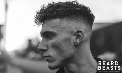 A man with a modern textured crop haircut and high skin fade styled forward — featured image for Beard Beasts’ guide on how to style a textured crop.