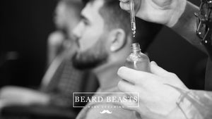 Man receiving beard oil treatment with high-quality beard oil ingredients for optimal beard health and growth by Beard Beasts Mens Grooming.