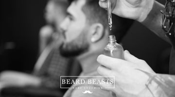 Man receiving beard oil treatment with high-quality beard oil ingredients for optimal beard health and growth by Beard Beasts Mens Grooming.
