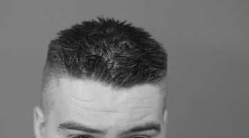 Man sporting a modern crew cut hairstyle with textured top and faded sides