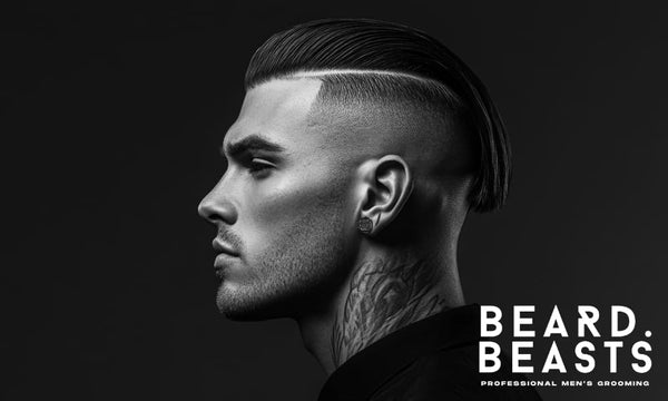 Profile of a man with a sharp disconnected slick back hairstyle and a bold undercut.