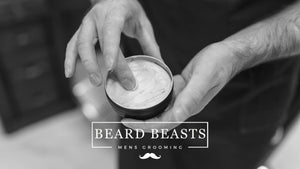 Man using a tin of hair clay for men from Beard Beasts Mens Grooming - ideal for achieving natural, textured hairstyles. Learn more in the Clay vs Pomade guide.
