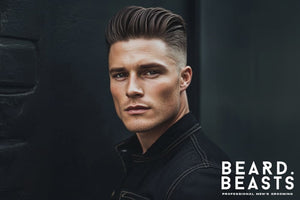 Portrait of a confident man with a classic undercut pompadour, featuring a sleek, voluminous top styled back with precision and sharp, faded sides. 