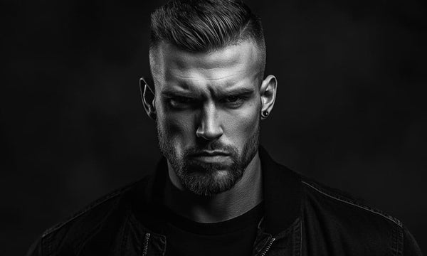 Confident man with short haircut and beard in black and white, representing short haircuts for men with beards