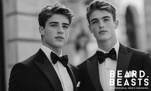 Two young men in tuxedos with styled prom hairstyles, standing confidently on a city street, ready for prom night.